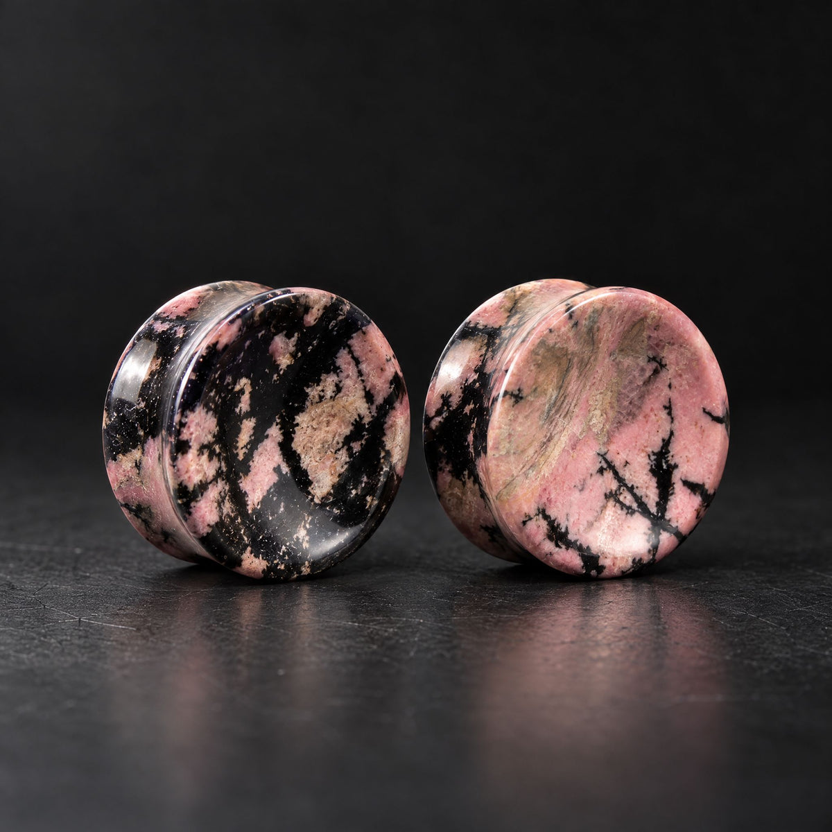 Pink / Black Rhodonite Concave Plugs, pair on black